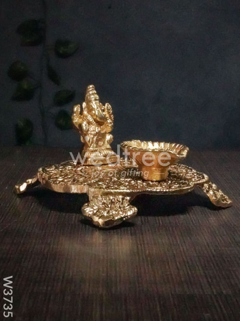 White Metal Chowki Ganesh With Diya Gold Finish - W3735 Diyas