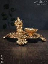 White Metal Chowki Ganesh With Diya Gold Finish - W3735 Diyas