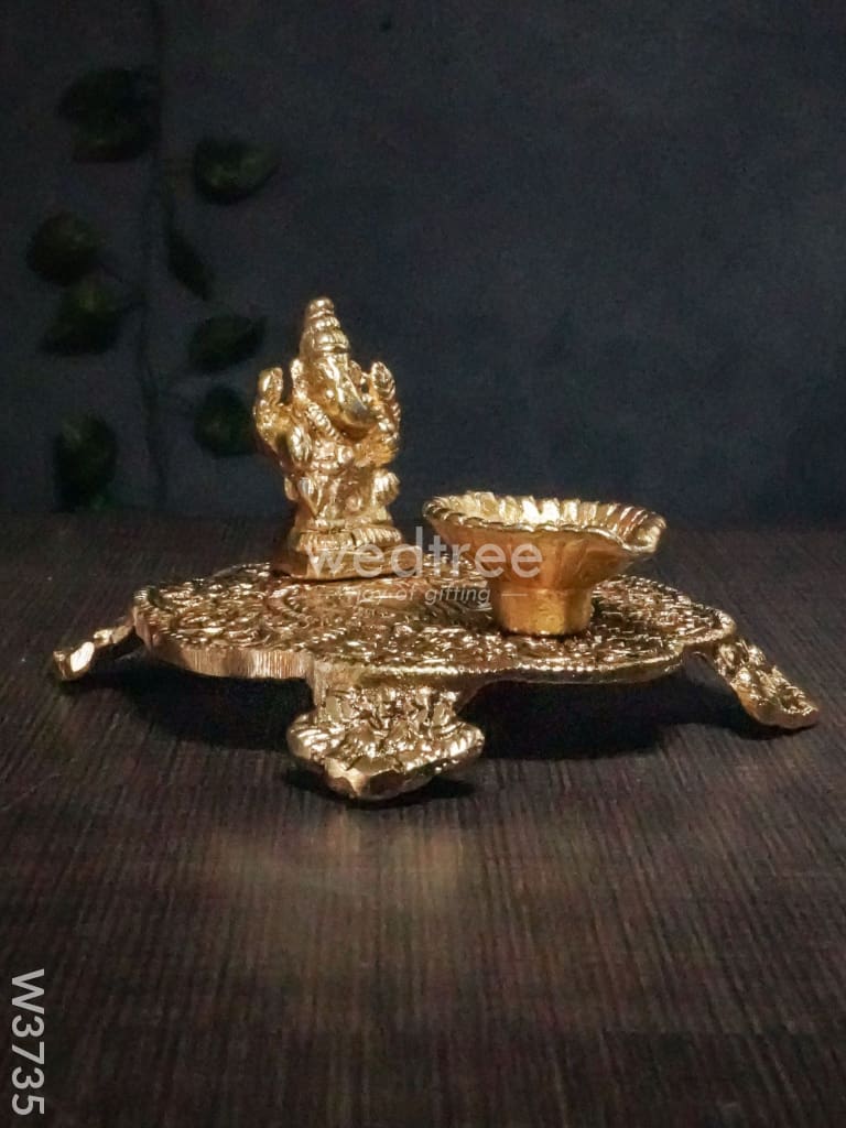 White Metal Chowki Ganesh With Diya Gold Finish - W3735 Diyas