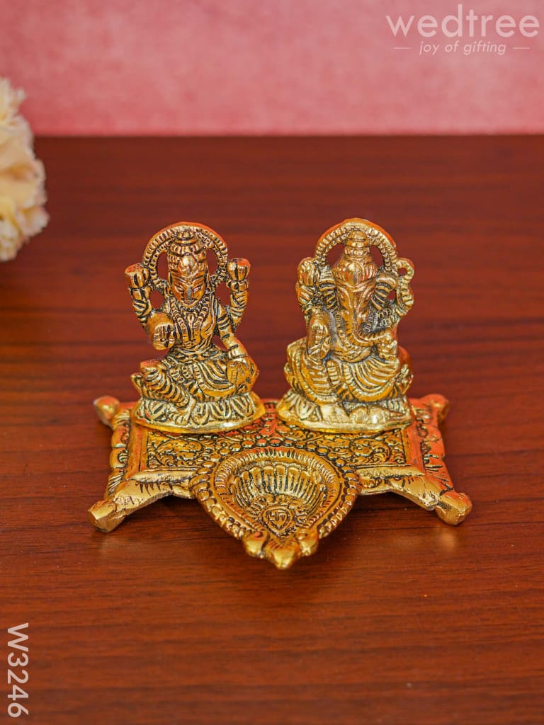 White Metal Gold Lakshmi Ganesha With Diya Divine Figurines