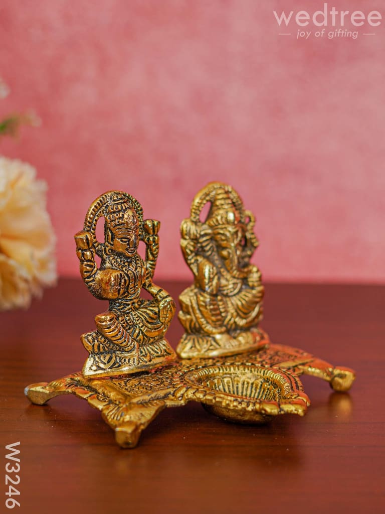 White Metal Gold Lakshmi Ganesha With Diya Divine Figurines