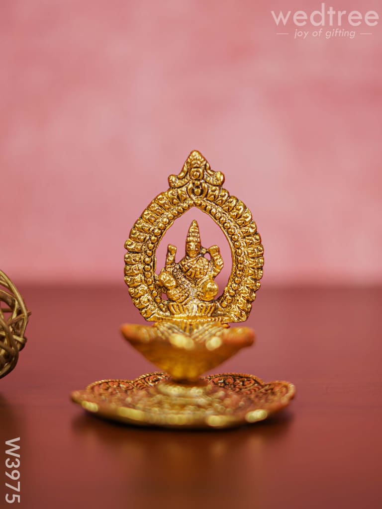 White Metal Lakshmi Hand Diya With Gold Finish - W3975 Diyas